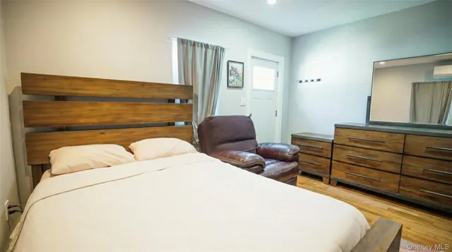 a bedroom with double bed and a window