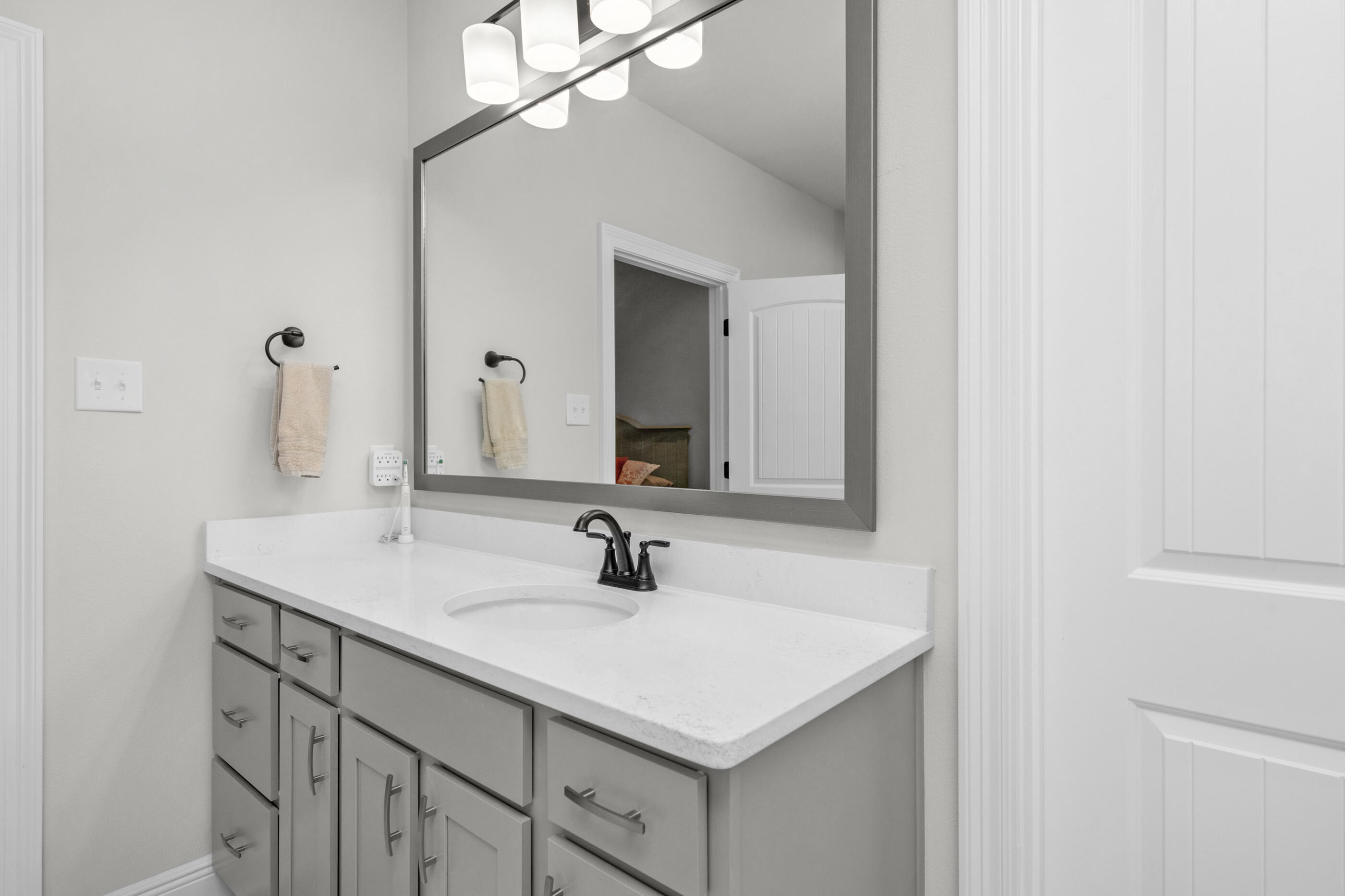 63 Alley Oak Lane Freeport, FL 32439 - Photo 11 of 50 a bathroom with a sink and a mirror