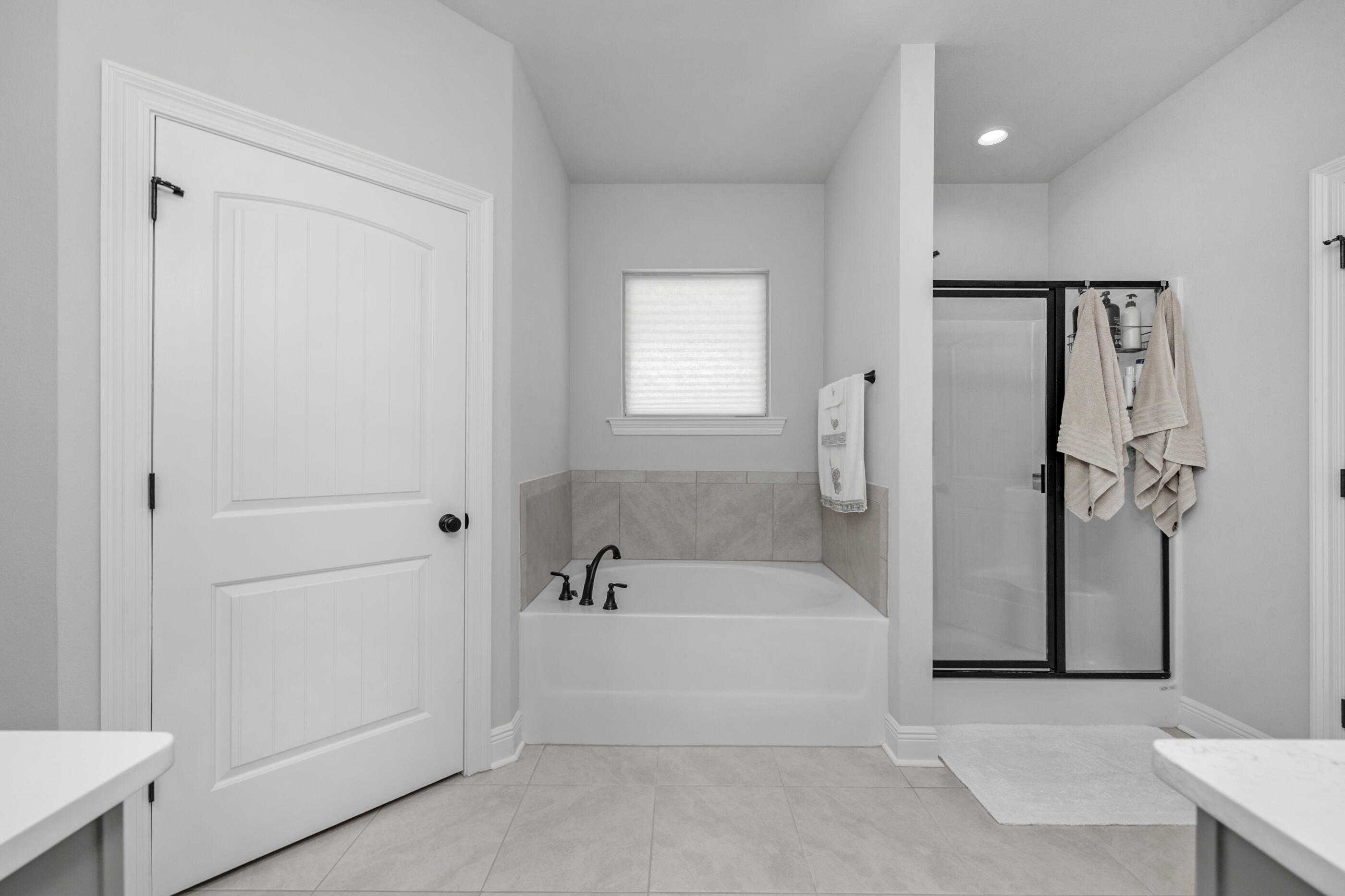 63 Alley Oak Lane Freeport, FL 32439 - Photo 13 of 50 a bathroom with a tub and shower