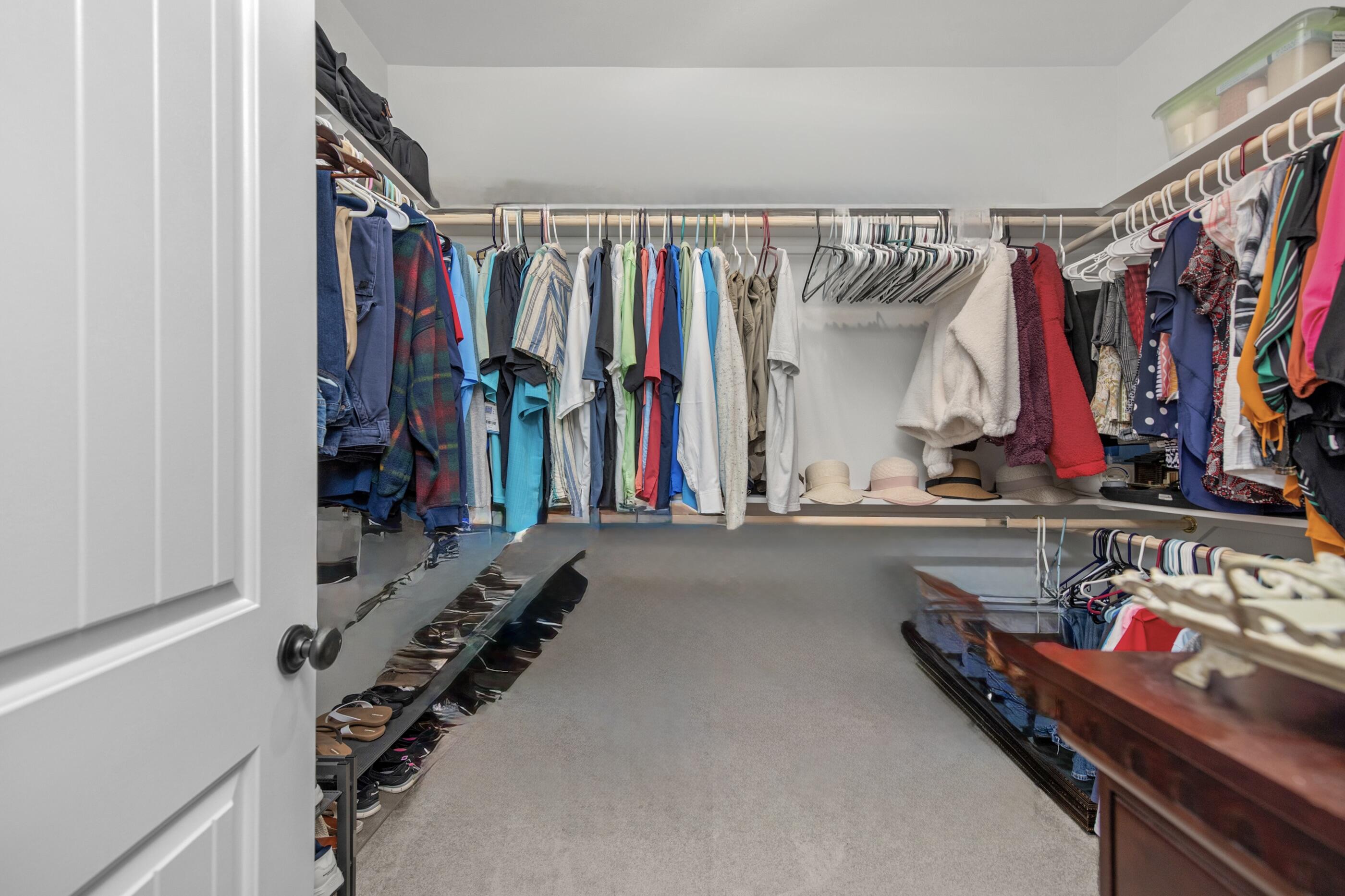 63 Alley Oak Lane Freeport, FL 32439 - Photo 14 of 50 a view of walk in closet with clothes