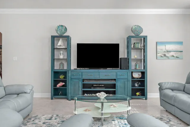 a large kitchen with a table and chairs