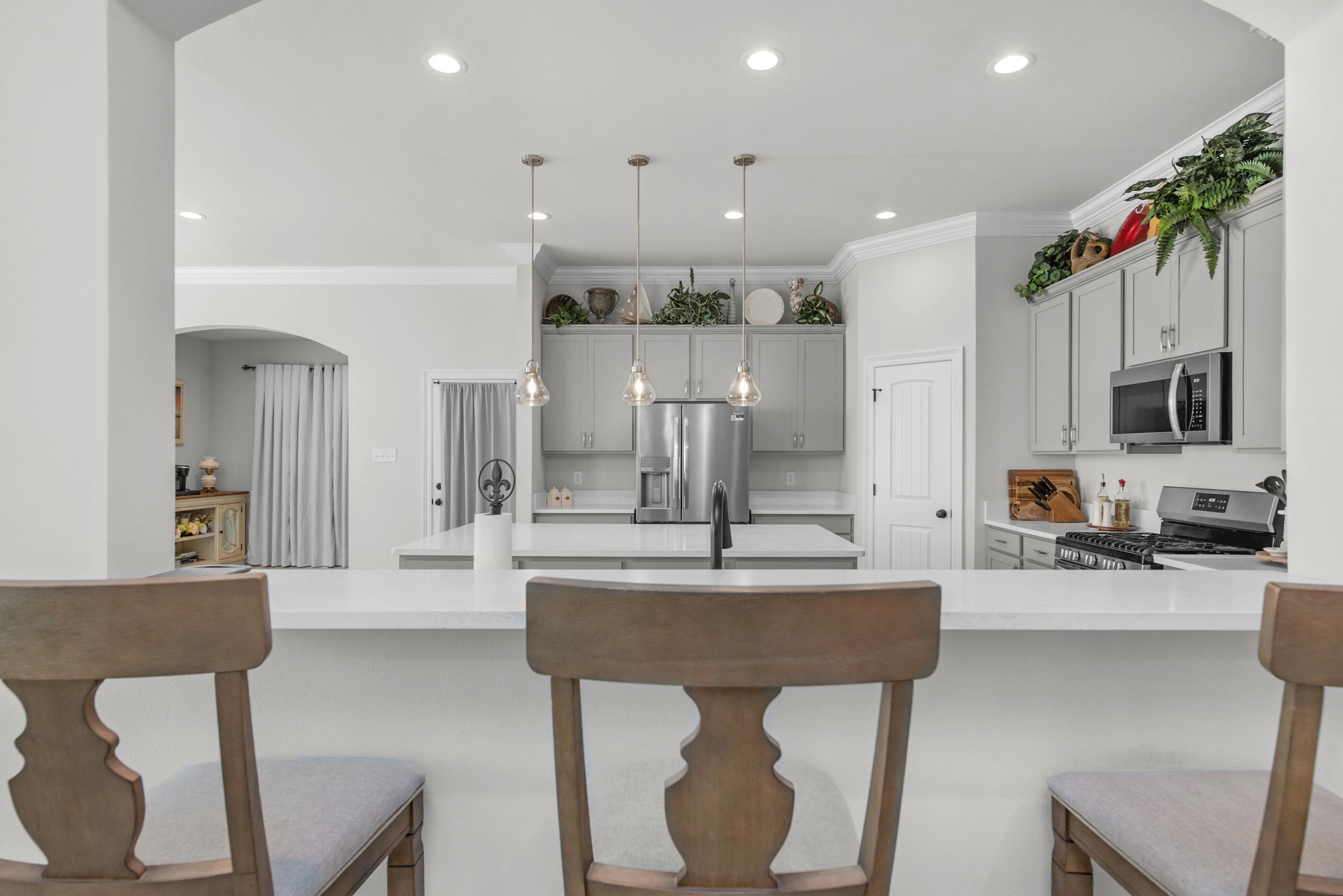 63 Alley Oak Lane Freeport, FL 32439 - Photo 22 of 50 a large kitchen with a table and chairs