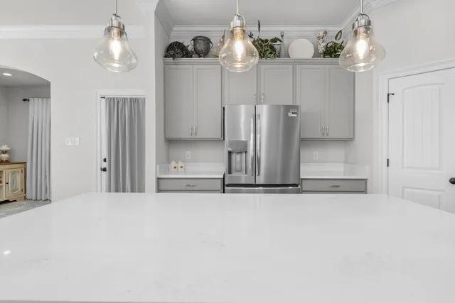 a kitchen with a sink and a stove top oven