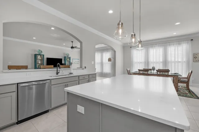 a kitchen with a sink stove and microwave