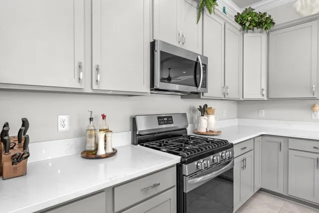 a kitchen with a sink and chandelier