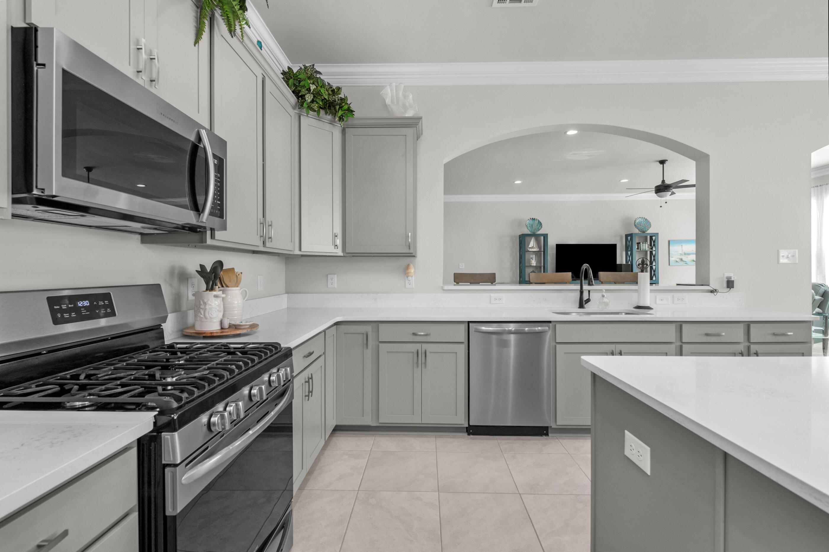 63 Alley Oak Lane Freeport, FL 32439 - Photo 29 of 50 a kitchen with a sink stove and microwave