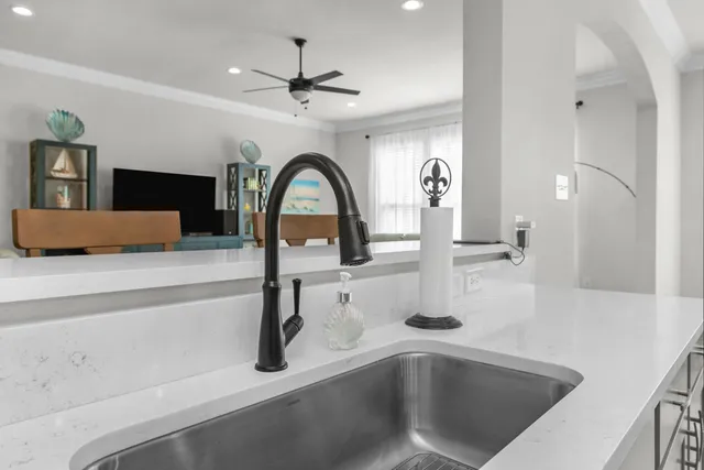 a large hall with a large window and chandelier