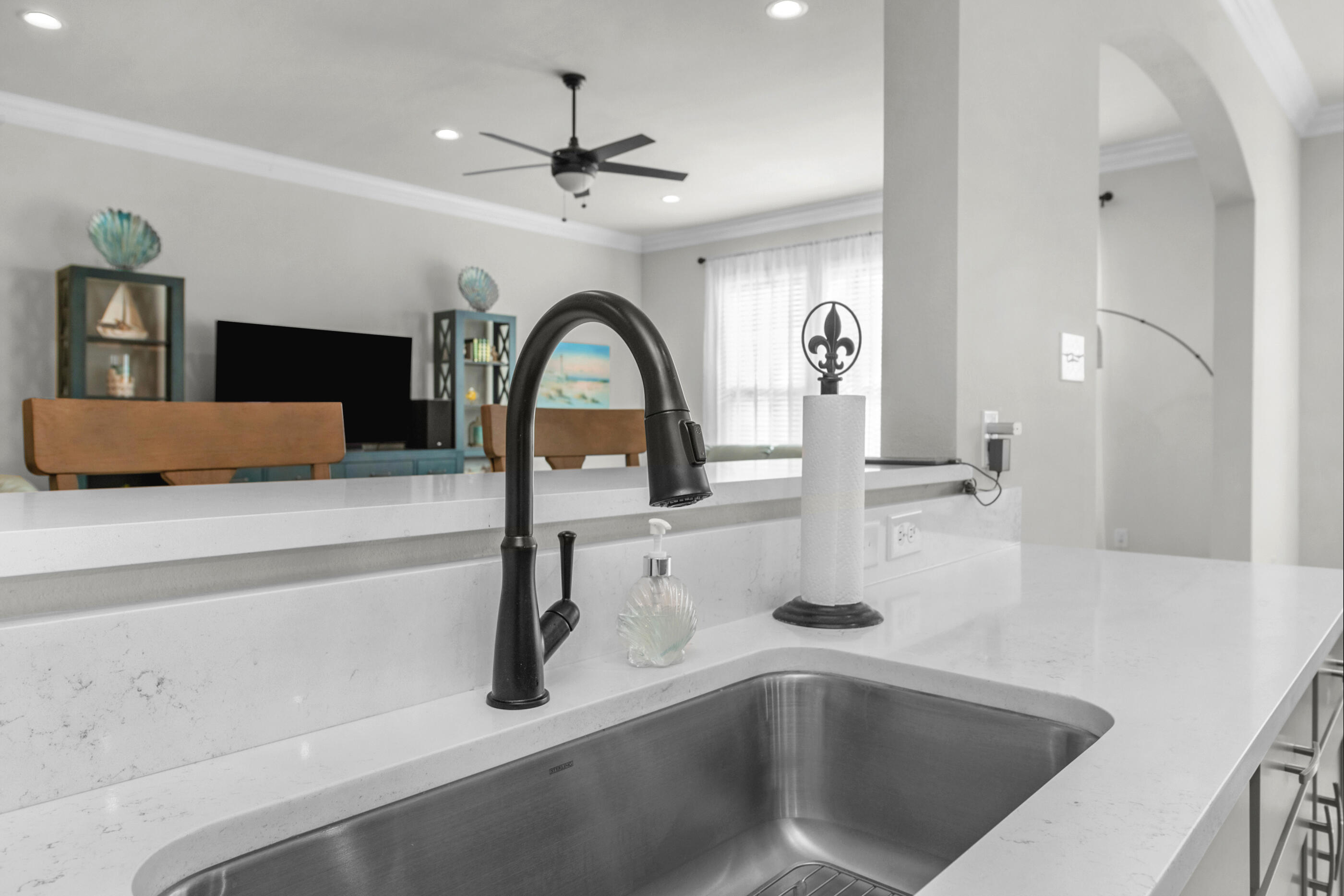 63 Alley Oak Lane Freeport, FL 32439 - Photo 30 of 50 a kitchen with a sink and chandelier