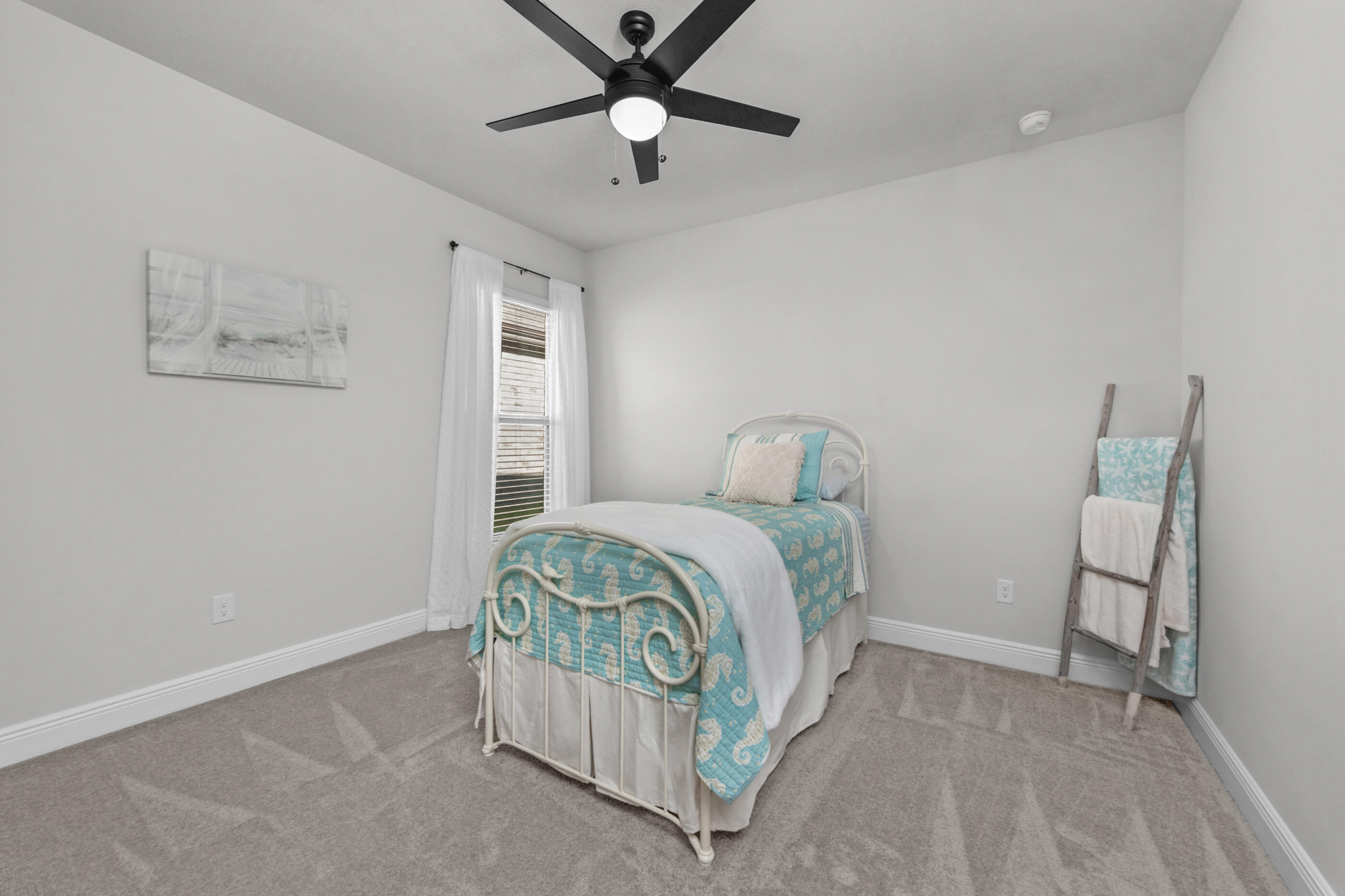 63 Alley Oak Lane Freeport, FL 32439 - Photo 37 of 50 a bedroom with a bed and window