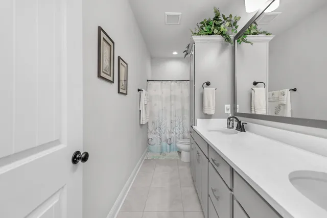 a bedroom with a bed and a book shelf