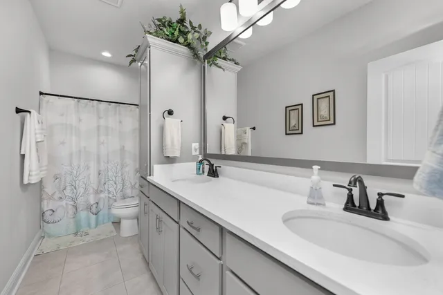 a bedroom with a bed rug and window