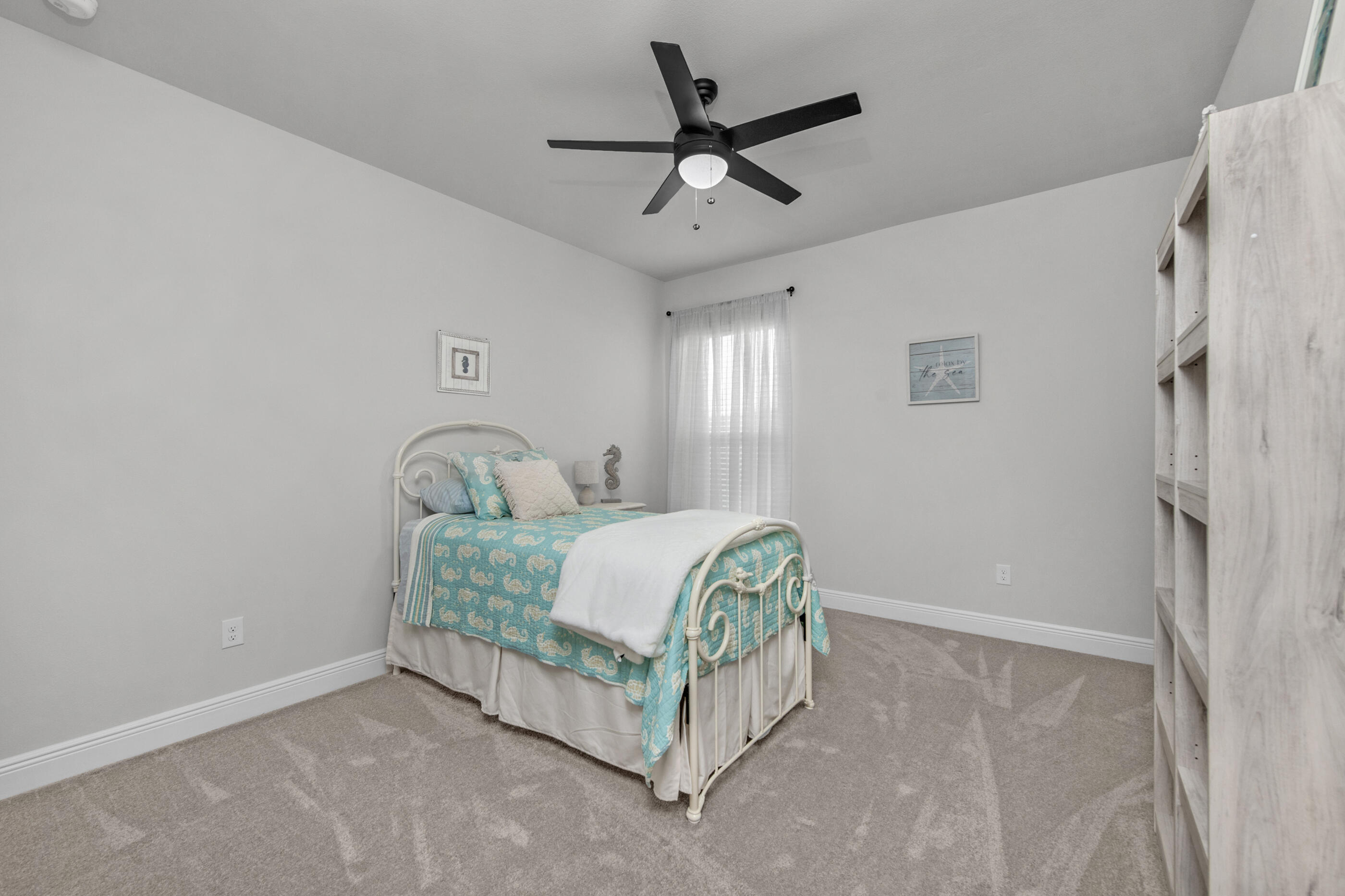 63 Alley Oak Lane Freeport, FL 32439 - Photo 42 of 50 a bedroom with a bed rug and window