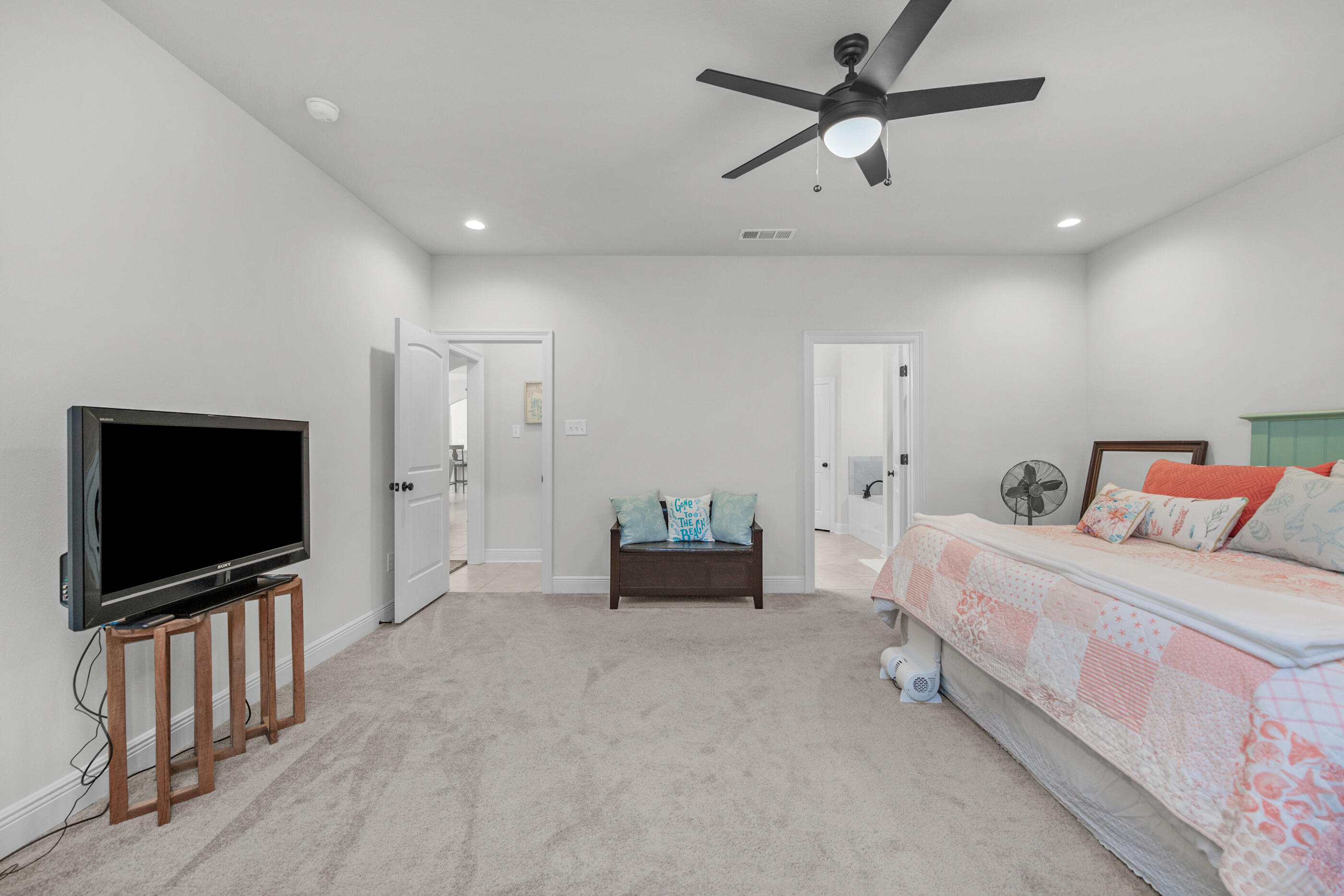 63 Alley Oak Lane Freeport, FL 32439 - Photo 7 of 50 a bedroom with furniture and a flat screen tv