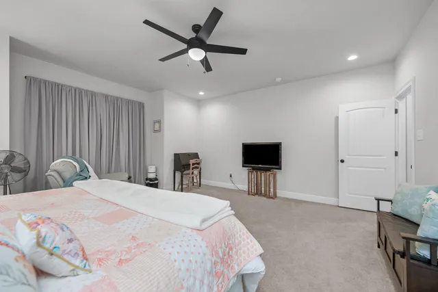 a spacious bathroom with a bathtub sink double and mirror