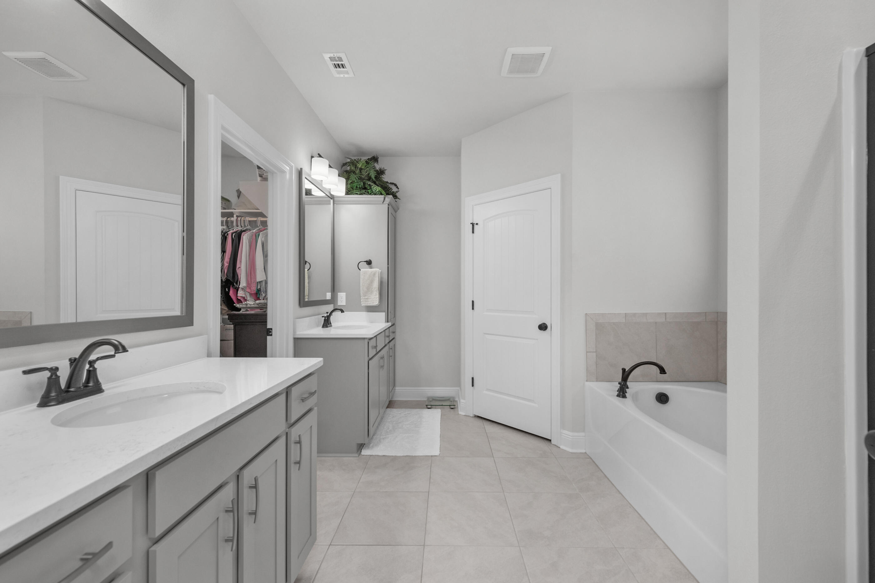 63 Alley Oak Lane Freeport, FL 32439 - Photo 9 of 50 a spacious bathroom with a bathtub sink double and mirror