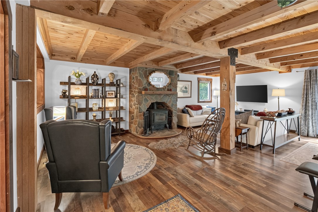 130 Maggie Rufus Lane Westminster, SC 29693 - Photo 33 of 50 Rich hardwood flooring and exposed wood beams define this inviting living room.
