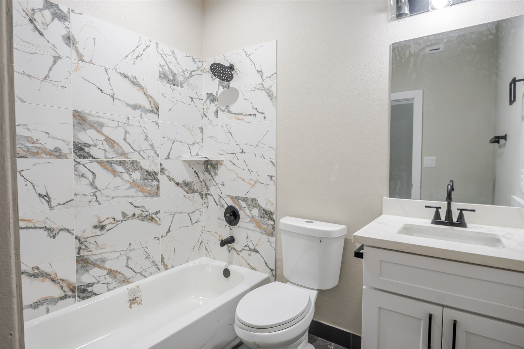 8709 Westcott Road, Unit A AND B Houston, TX 77016 - Photo 11 of 14 a bathroom with a sink toilet and shower