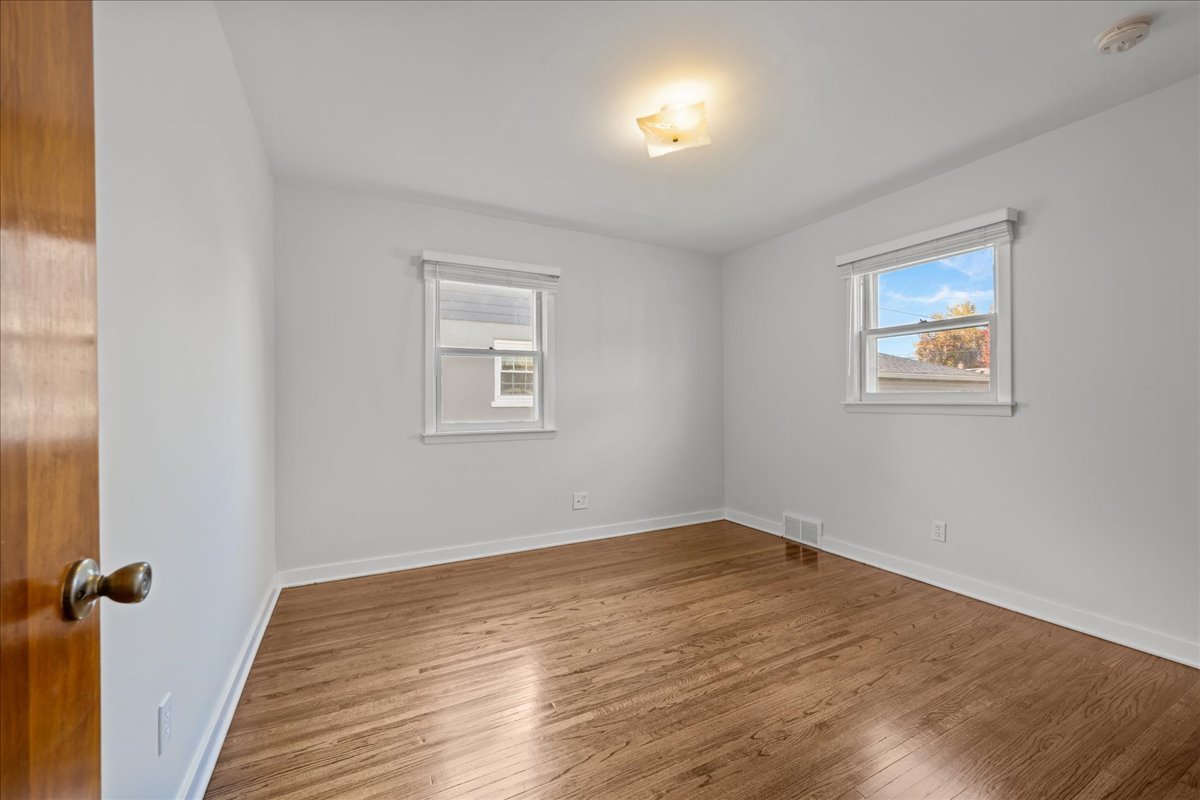 425 Ingleside Avenue Aurora, IL 60506 - Photo 10 of 13 a view of a room with wooden floor and windows