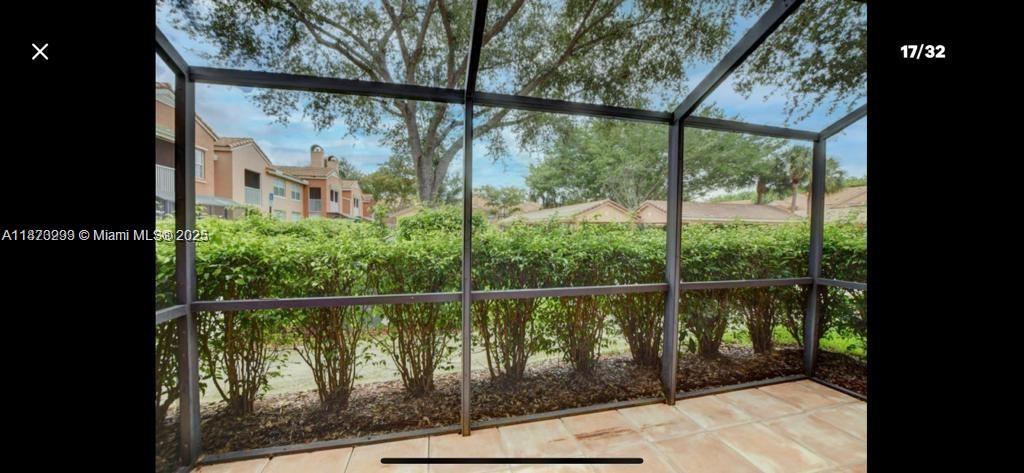 3259 Clint Moore Road, Unit 103 Boca Raton, FL 33496 - Photo 11 of 40 a view of a fence from a window