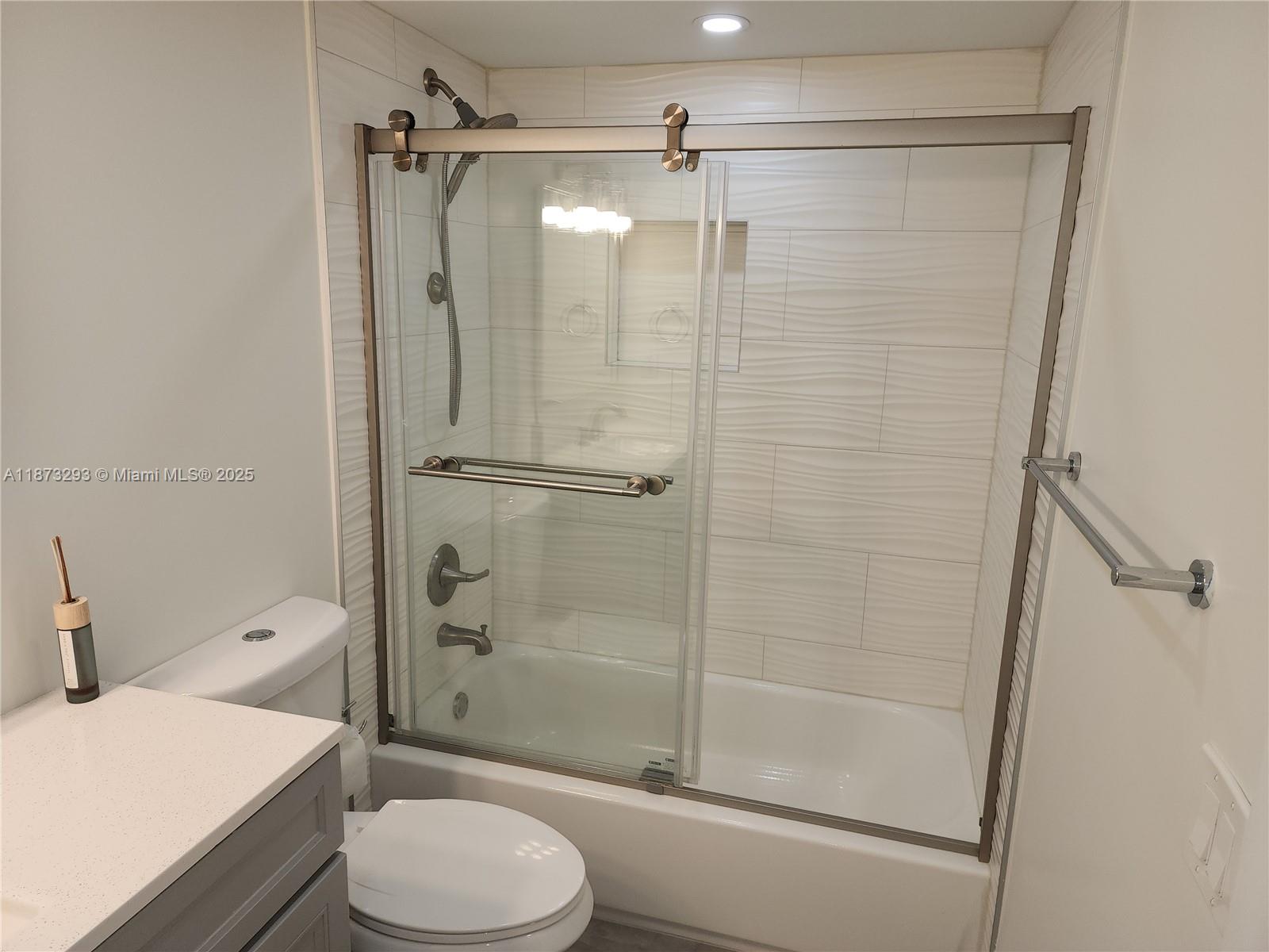 3259 Clint Moore Road, Unit 103 Boca Raton, FL 33496 - Photo 20 of 40 a bathroom with a sink toilet and shower