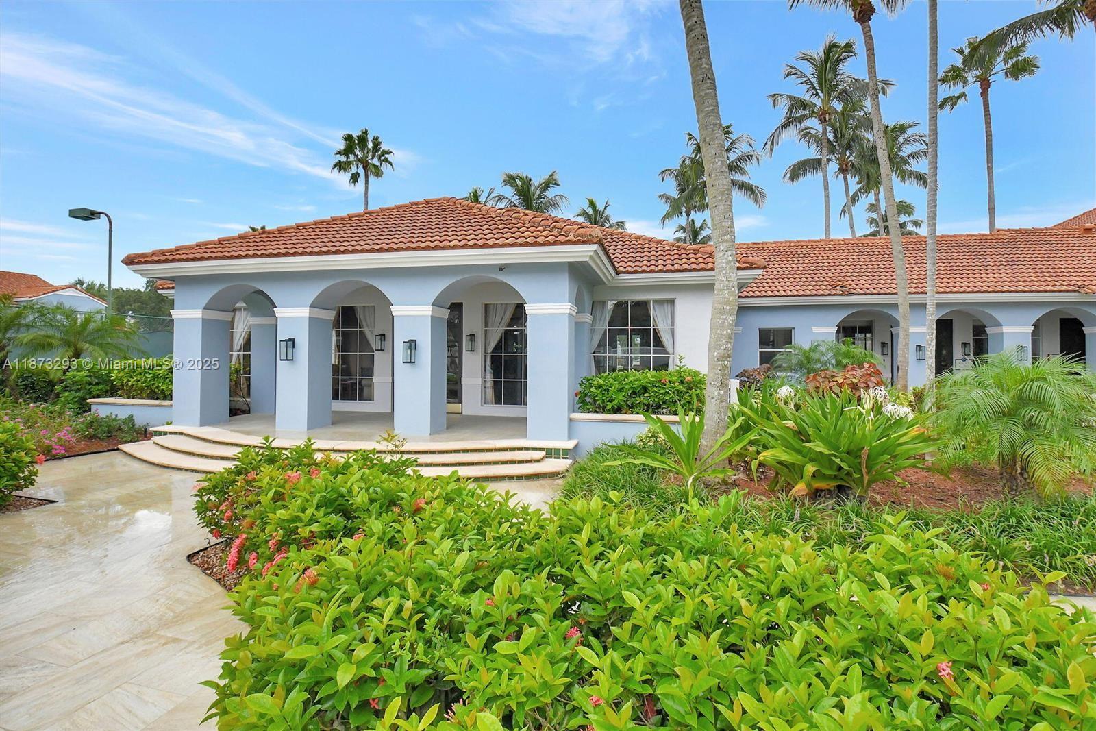 3259 Clint Moore Road, Unit 103 Boca Raton, FL 33496 - Photo 24 of 40 front view of a house with a yard
