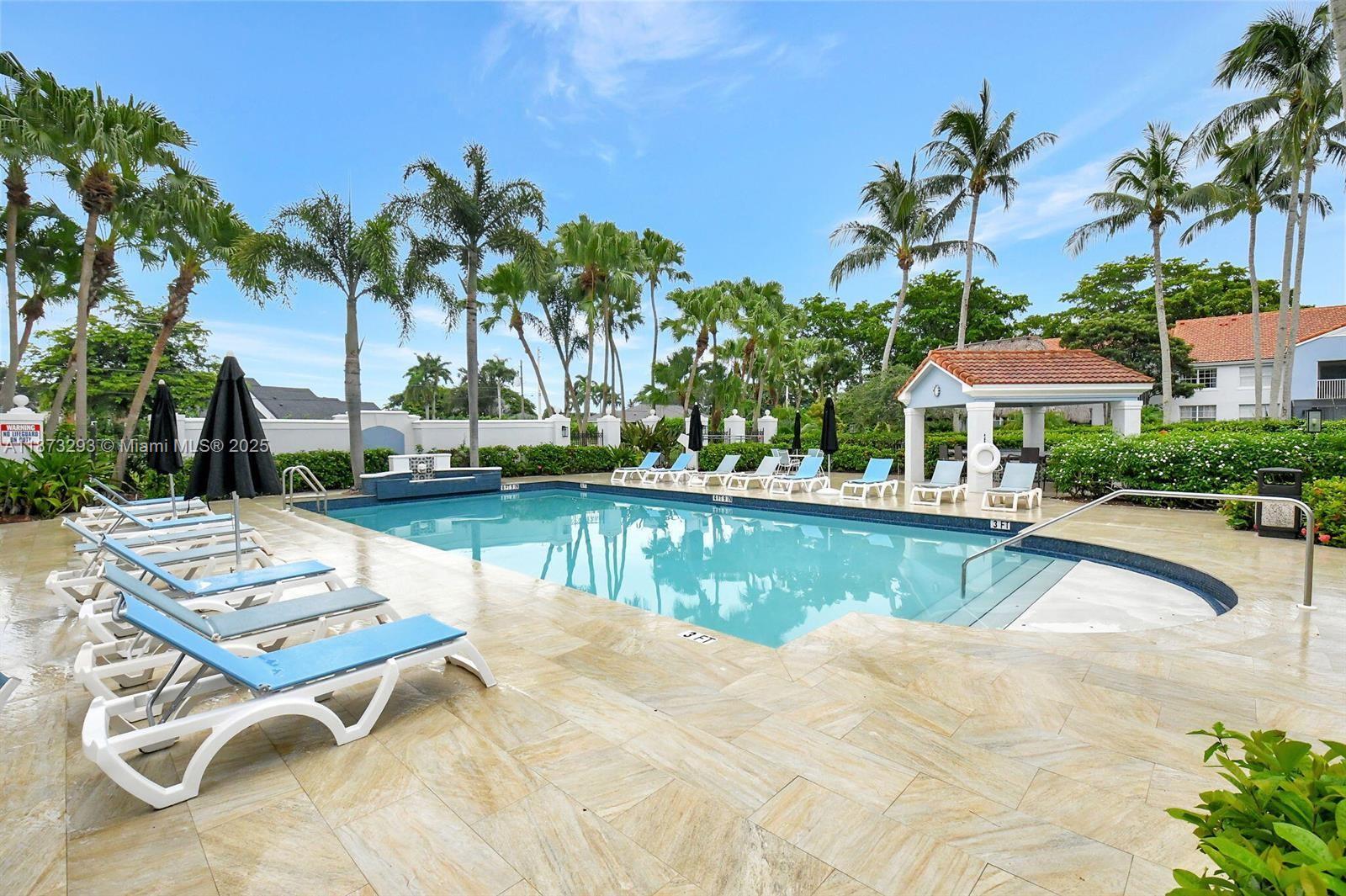 3259 Clint Moore Road, Unit 103 Boca Raton, FL 33496 - Photo 28 of 40 a view of swimming pool with outdoor seating and yard