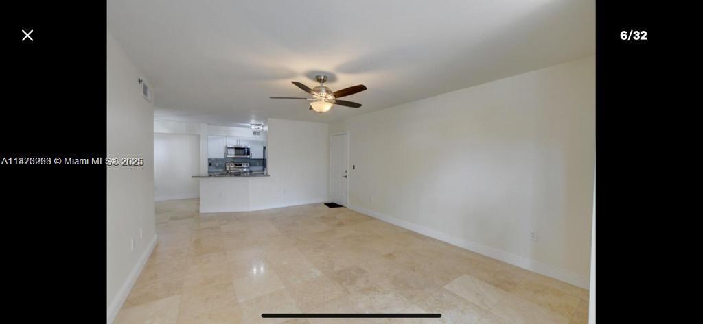 3259 Clint Moore Road, Unit 103 Boca Raton, FL 33496 - Photo 5 of 40 view of a big room with closet and a ceiling fan