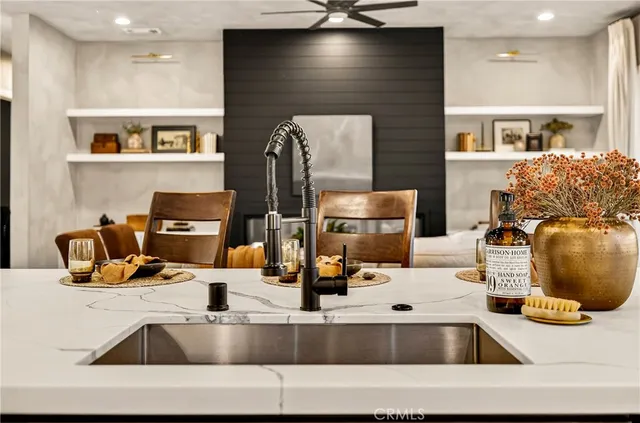 a view of a dining room with furniture and chandelier