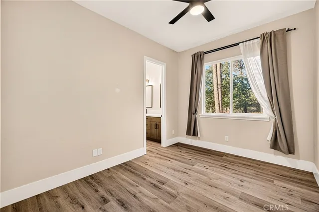 a view of a patio with table and chairs and potted plants