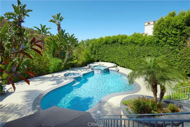 a view of a garden with a house