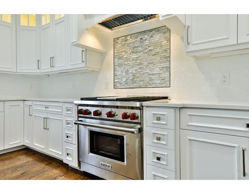 144 Schoolmasters Lane Dedham, MA 02026 - Photo 13 of 29 a kitchen with white cabinets and white appliances
