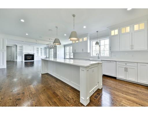 144 Schoolmasters Lane Dedham, MA 02026 - Photo 14 of 29 a kitchen with kitchen island granite countertop a sink cabinets and wooden floor