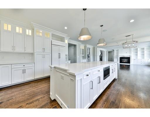 144 Schoolmasters Lane Dedham, MA 02026 - Photo 15 of 29 a kitchen with stainless steel appliances sink and cabinets