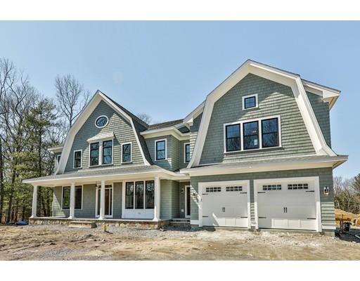 144 Schoolmasters Lane Dedham, MA 02026 - Photo 2 of 29 a front view of a house with a garden