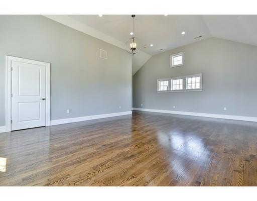 144 Schoolmasters Lane Dedham, MA 02026 - Photo 28 of 29 a view of an empty room with wooden floor and a window