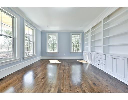 144 Schoolmasters Lane Dedham, MA 02026 - Photo 6 of 29 a view of an empty room with a window and wooden floor