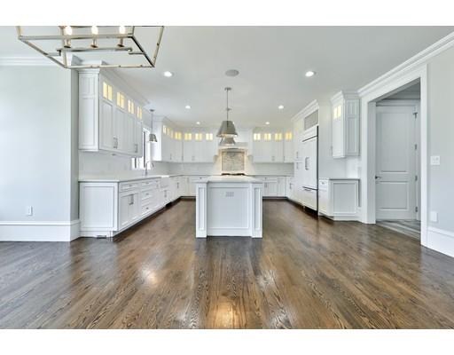 144 Schoolmasters Lane Dedham, MA 02026 - Photo 9 of 29 a large kitchen with stainless steel appliances granite countertop a dishwasher a stove a refrigerator and white cabinets with wooden floors