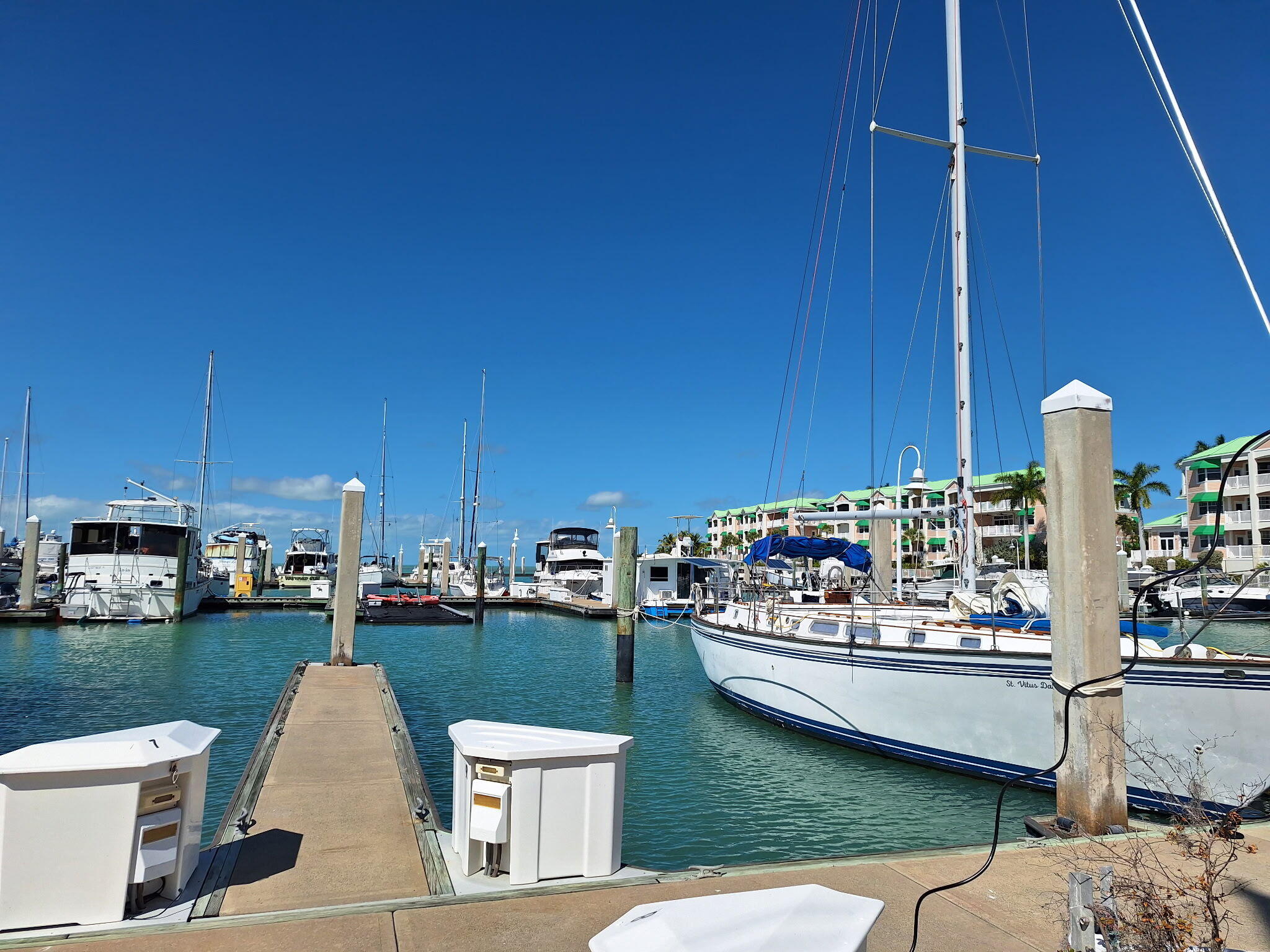 5555 College Road, Unit 9 Key West, FL 33040 - Photo 7 of 10 a view of a balcony with chairs and potted plants
