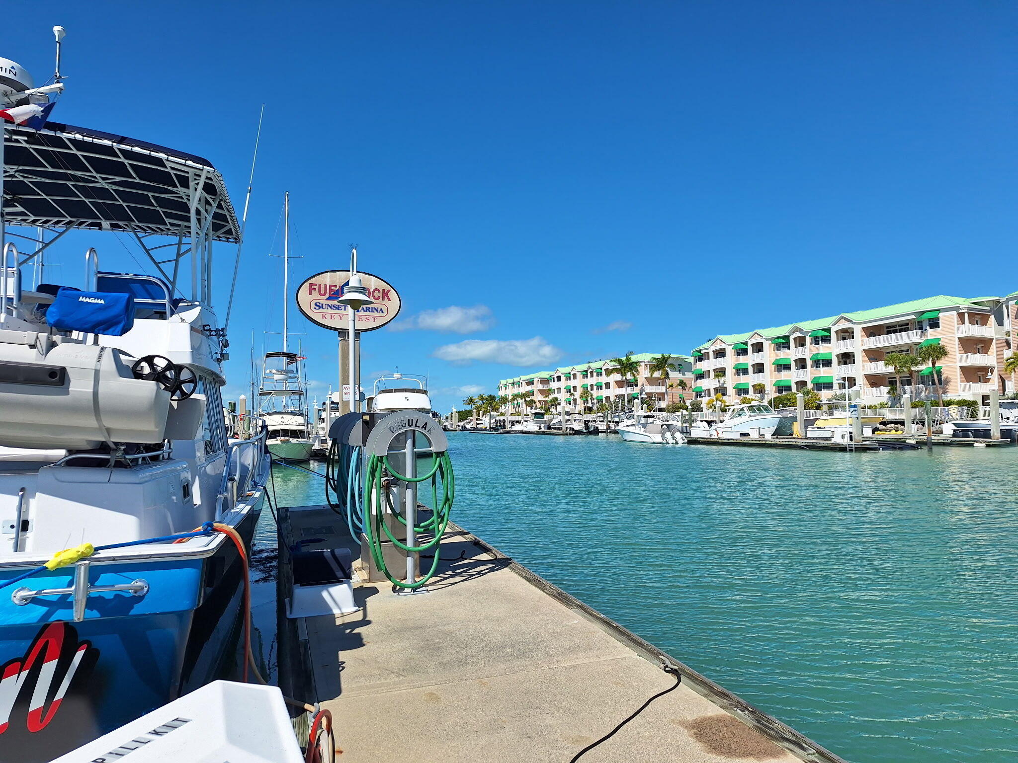 5555 College Road, Unit 9 Key West, FL 33040 - Photo 9 of 10 a view of a chairs and table in patio with swimming pool