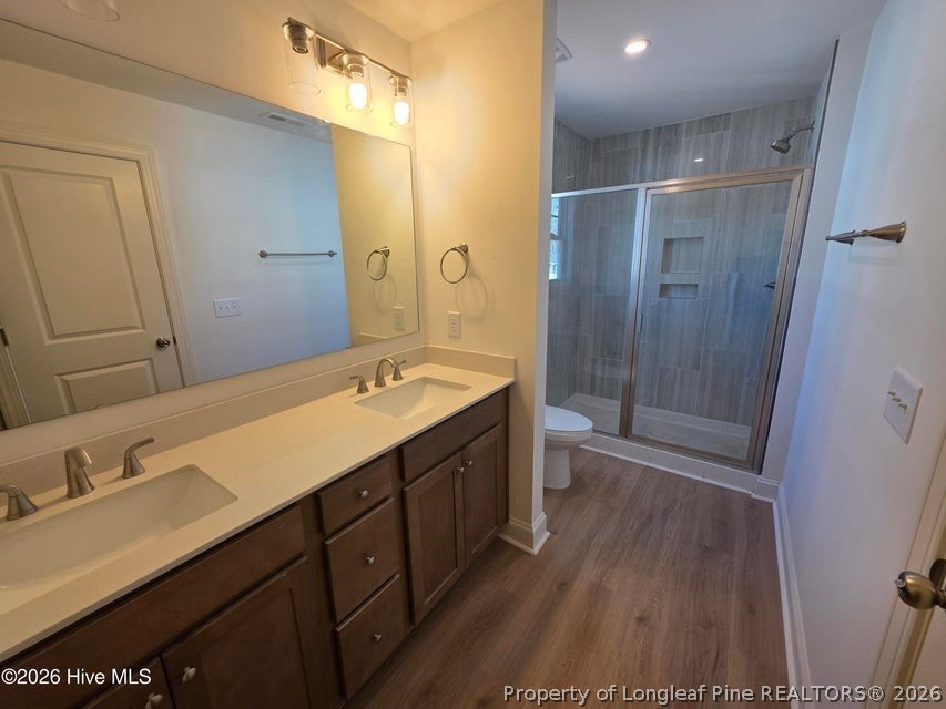 142 Carver Street Carthage, NC 28327 - Photo 35 of 40 a spacious bathroom with a double vanity sink a toilet and a shower