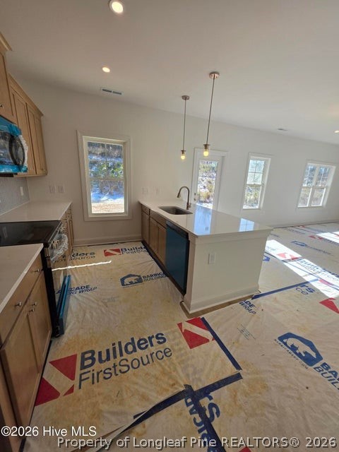 142 Carver Street Carthage, NC 28327 - Photo 10 of 40 a living room with a rug and a table