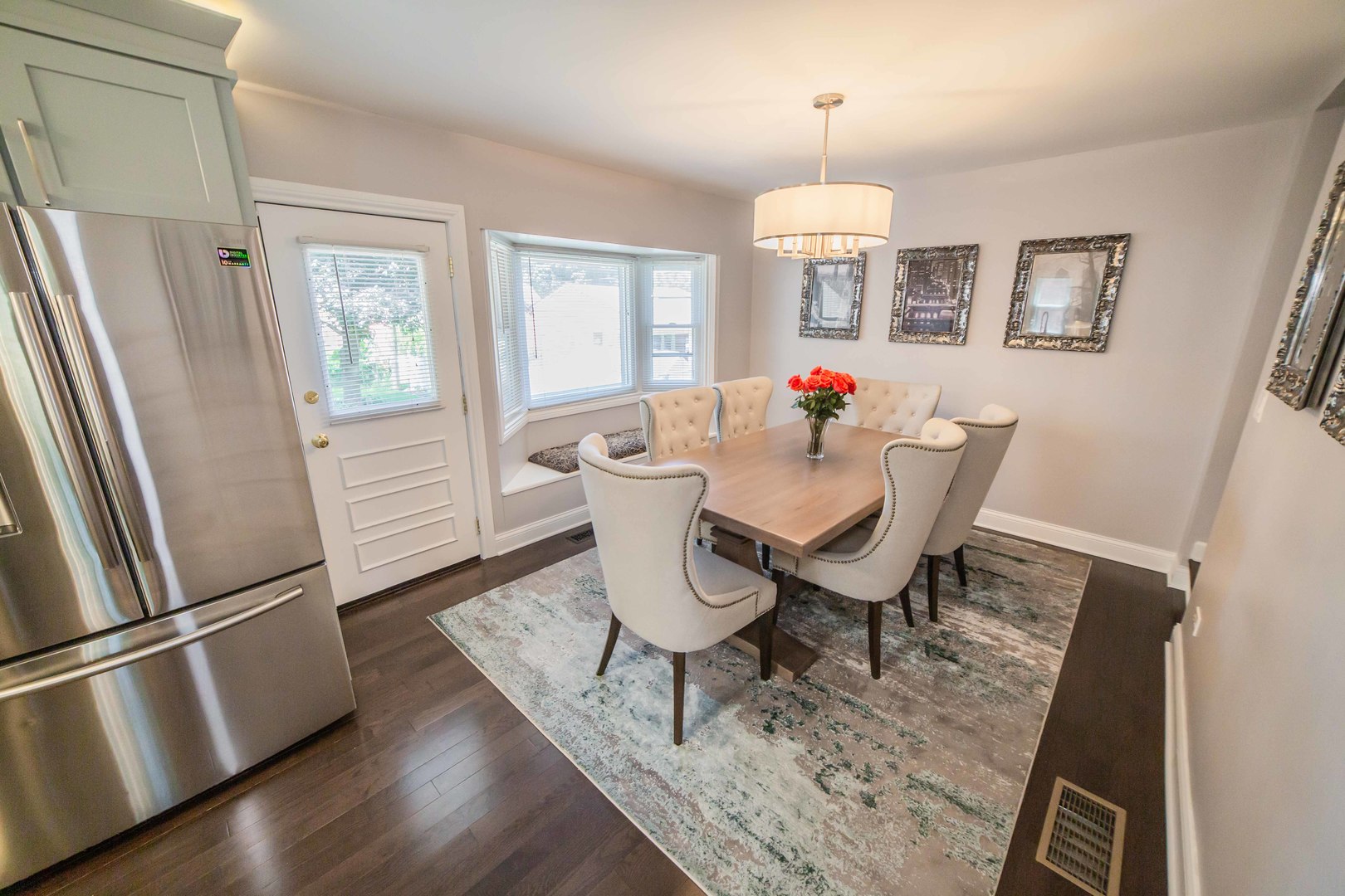 1924 Linden Avenue Park Ridge, IL 60068 - Photo 13 of 28 a view of a dining room with furniture wooden floor and a chandelier