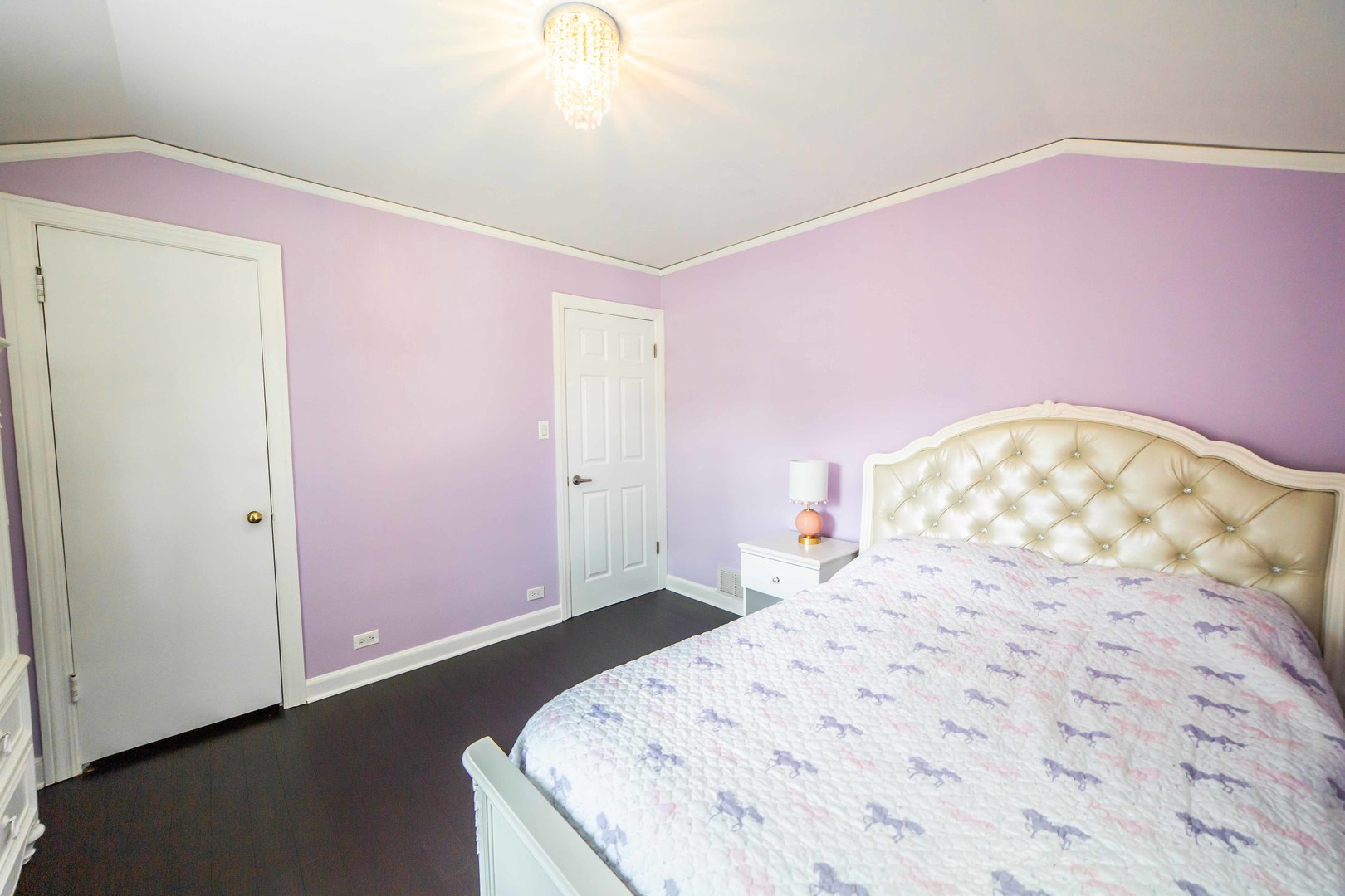 1924 Linden Avenue Park Ridge, IL 60068 - Photo 24 of 28 a bedroom with a bed and a chandelier