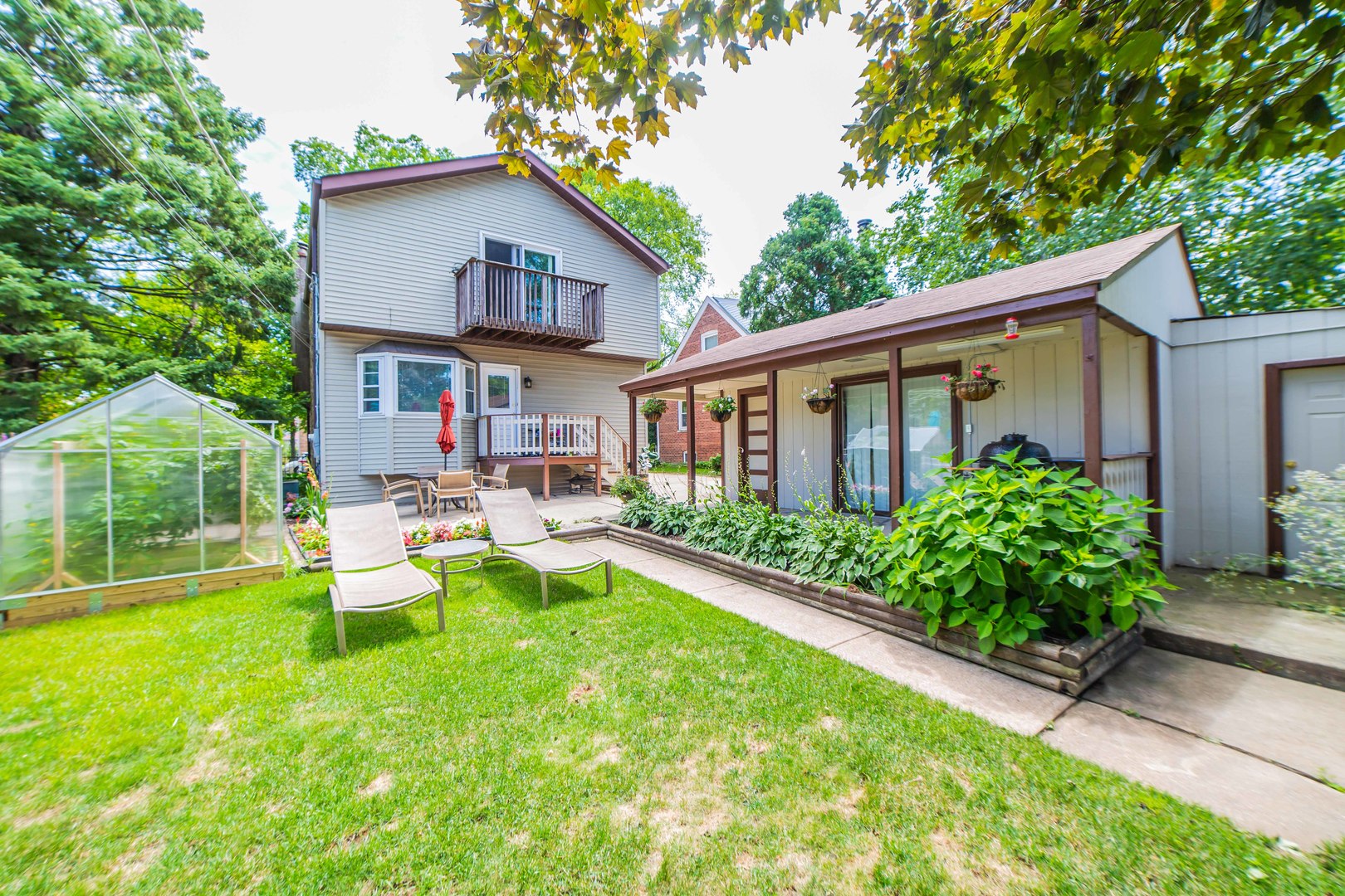 1924 Linden Avenue Park Ridge, IL 60068 - Photo 28 of 28 a view of a house with backyard sitting area and garden