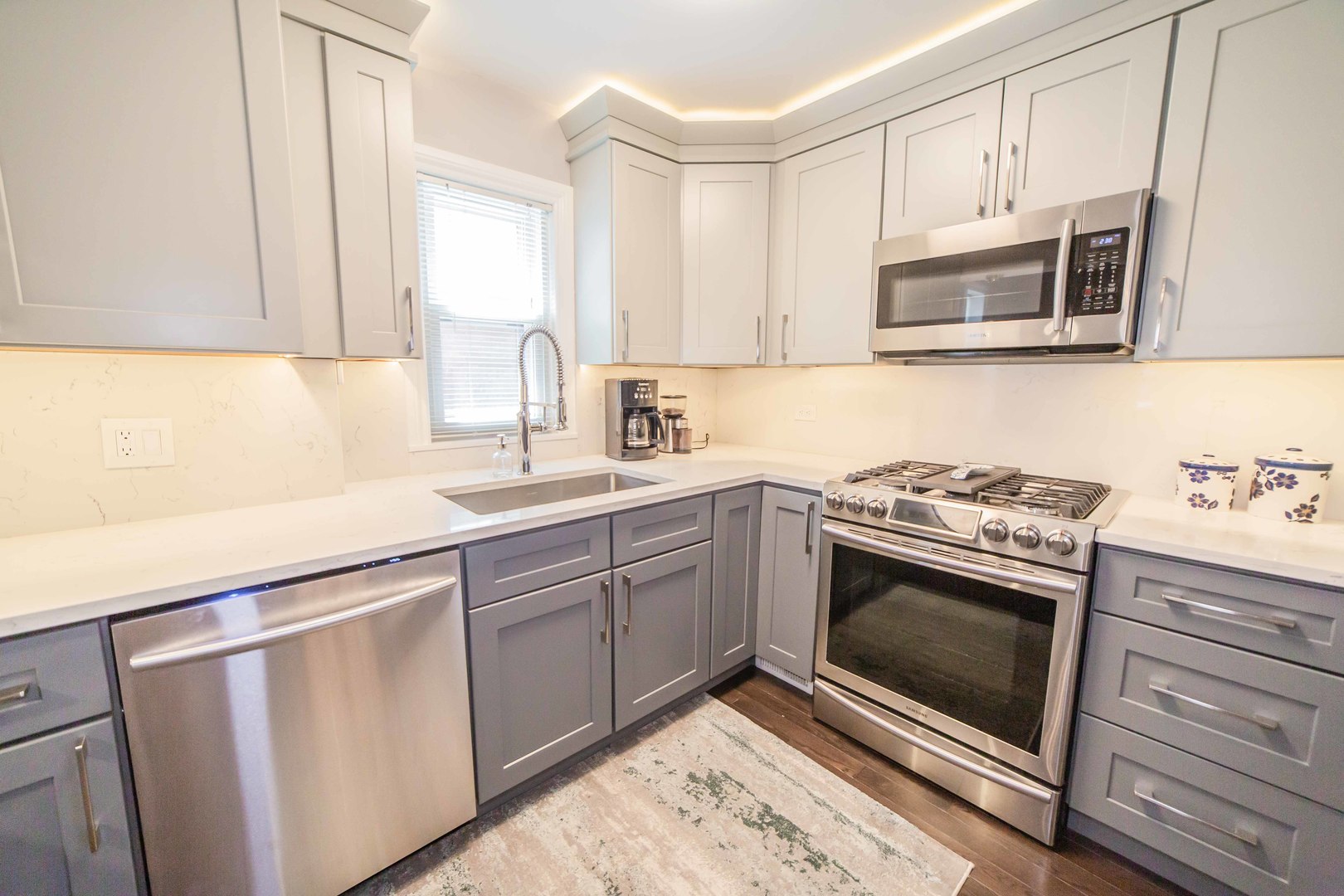 1924 Linden Avenue Park Ridge, IL 60068 - Photo 6 of 28 a kitchen with white cabinets stainless steel appliances and sink