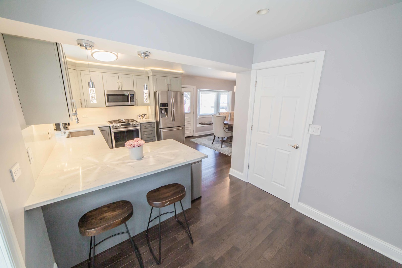 1924 Linden Avenue Park Ridge, IL 60068 - Photo 9 of 28 a view of a kitchen area with furniture and wooden floor