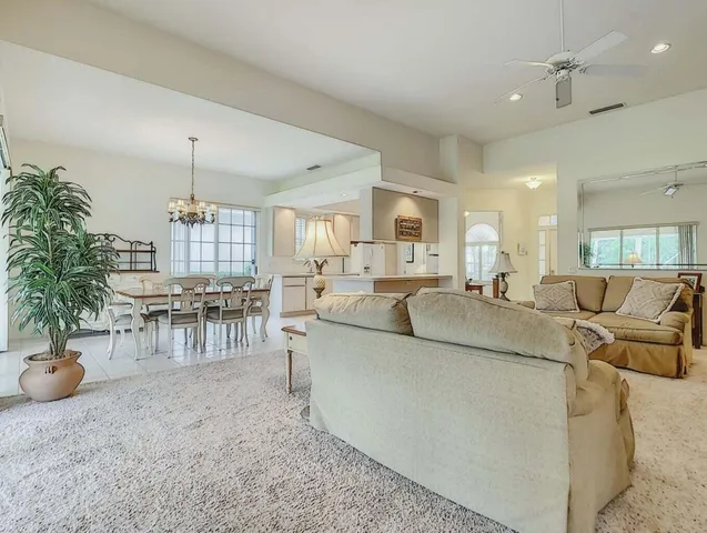 a spacious bedroom with a bed and a window