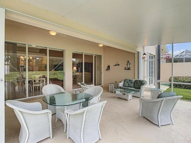 a bathroom with a shower and a glass door