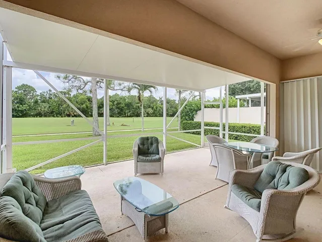 a bathroom with a granite countertop sink a toilet and a shower