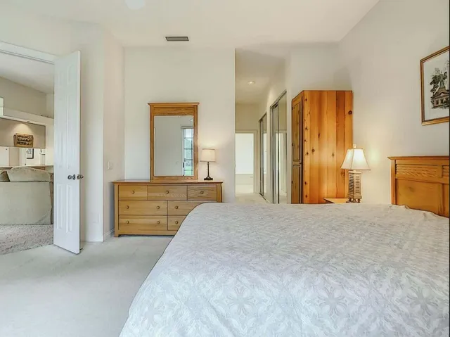 a bedroom with two beds and a window